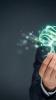 Businessman hand holding glowing light bulb with energy waves on dark background, representing innovation, ideas, and creative solutions for business and technology concepts.