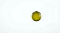 Golden yellow oil droplet isolated on white background for culinary and wellness design projects.
