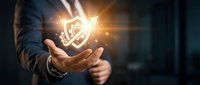 Businessman holding glowing light bulb with bright energy rays, representing innovation, ideas, and creative solutions for business growth and success.