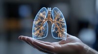 Glowing holographic lungs floating above open palm showing detailed bronchial tree structure with luminous effect against dark background for medical visualization.
