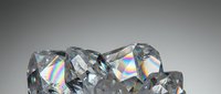 Sparkling cut diamonds with rainbow reflections on gradient background for luxury jewelry and gemstone marketing materials.