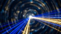 Abstract light trails in tunnel creating dynamic motion blur effect with blue and golden streaks for technology and speed concepts.