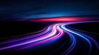 Curved light trails in motion creating dynamic neon streaks of pink, purple and blue colors against dark background, abstract long exposure effect.