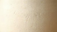 Beige textured surface with subtle grain and speckles, suitable for backgrounds, design overlays, and minimalist compositions.