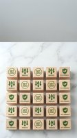 Wooden blocks with eco-friendly symbols including net zero, reduce and shield icons arranged in grid pattern on marble surface for sustainable business concepts.