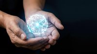 Hands of a middle-aged male with medium skin tone holding a glowing digital globe, representing global connectivity, technology innovation, and worldwide business solutions.