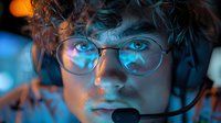 Young male customer service representative wearing headset and glasses illuminated by blue and orange light, dramatic close-up portrait showing intense focus.