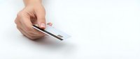 Hand holding smartphone with blank white screen on clean white background, isolated for mockup and app presentation designs.