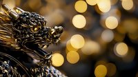 Golden dragon statue head with ornate Asian details against blurred bokeh lights background creating mystical oriental atmosphere.