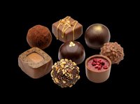 Assorted luxury chocolate truffles and pralines isolated on transparent background, ready for confectionery menus, stickers, print on demand, and T-shirt design use.