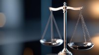 Golden scales of justice with balanced pans on blurred background symbolizing law, legal system, fairness and judicial decisions in courtroom setting.