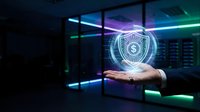 Business professional displaying holographic financial security shield with dollar symbol in modern data center environment for fintech applications.