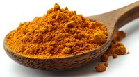 Ground turmeric powder in wooden spoon against white background, bright orange-yellow spice used in Asian cuisine and natural medicine, macro food photography.