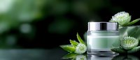 Luxury cosmetic jar with green botanical elements on dark reflective surface against blurred natural background. Skincare and beauty product presentation.