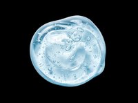 Clear blue gel drop with bubbles, isolated on transparent background. Ready for skincare, cosmetic, beauty product design, stickers, print on demand, and T-shirt use.