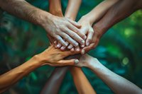 Diverse hands joined together in unity showing teamwork, collaboration and community support. Perfect for social inclusion, diversity and partnership concepts in business or social projects.