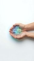 Hands holding glowing neon cross with heart symbol on white background, representing healthcare, charity, medical support, and compassionate care concepts.