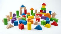 Colorful wooden building blocks set with geometric shapes including cubes, cylinders, triangles and rectangles for educational play and creativity development.