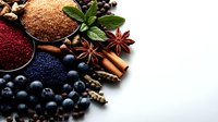 Colorful spices and seasonings collection with cinnamon, star anise, peppercorns, seeds and fresh mint leaves arranged on white background for cooking.