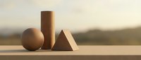 Minimalist wooden geometric shapes sphere cylinder pyramid arranged on clean surface with soft natural lighting and blurred landscape background for modern design.