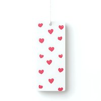 White hanging tag with pink heart pattern on isolated background, ready for gift wrapping, wedding favors and romantic packaging designs.