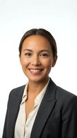 Professional Asian businesswoman in dark suit smiling confidently on white background, isolated for corporate and business design projects.
