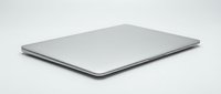 Closed silver laptop computer on white background, suitable for technology, business, and corporate design projects.