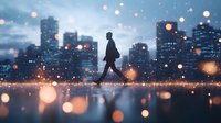 Silhouette of person walking in urban winter evening with bokeh snow effect and city skyline reflection on wet surface. Moody atmospheric scene.