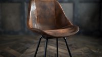 Brown leather chair with modern design on black metal legs against dark background, highlighting luxurious texture and minimalist style for interior design and furniture concepts.