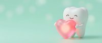 Cute cartoon tooth character holding pink heart on soft mint green background for dental care and oral health campaigns.