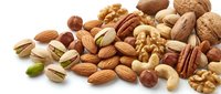 Mixed nuts and seeds collection including almonds, walnuts, cashews, pistachios, hazelnuts and pecans isolated on white background for healthy snacking.