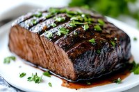 Juicy grilled beef steak with caramelized glaze and fresh herbs garnish on white plate, close-up view showing grill marks and medium-rare doneness.