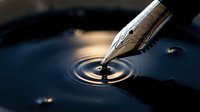 Ornate fountain pen nib creating ripples in dark water, symbolizing writing, creativity, and communication for editorial and design projects.