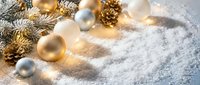 Golden and silver Christmas ornaments with pine cones and warm fairy lights on snowy white background for holiday decorating and seasonal greeting cards.