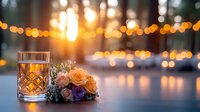 Elegant crystal glass with peach and purple roses on a table at golden hour, soft bokeh lights glowing in the background at an outdoor event.