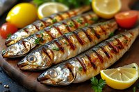 Grilled whole fish with lemon slices and herbs on wooden board. Fresh seafood dinner preparation with tomatoes and parsley for healthy Mediterranean cuisine.