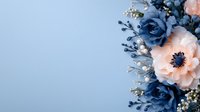 Elegant floral arrangement with navy blue roses and peach anemone flowers adorned with delicate white baby's breath against soft blue background. Perfect for wedding design.