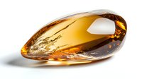 Polished amber stone with natural inclusions on white background, golden honey color mineral specimen showing characteristic transparency and internal patterns.
