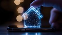 Glowing blue hologram house shape floating above smartphone screen with sparkle effects and bokeh lights in dark background, digital real estate concept.
