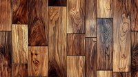 Rich brown hardwood flooring pattern with natural wood grain texture and varied plank sizes creates rustic warmth. Seamless design for interior decor backgrounds.