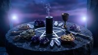 Mystical altar setup with pentagram, burning candle, crystals, herbs and ritual tools on dark stone surface for spiritual practices and witchcraft ceremonies.