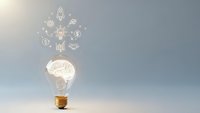 Creative lightbulb with brain and business icons representing innovation, entrepreneurship, and strategic thinking for corporate presentations.