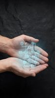 Caucasian male hands holding glowing digital circuit board schematic with interconnected technology icons and network symbols against dark textured background for innovation and tech concepts.