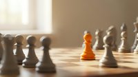 Young male chess player strategizing with orange pawn surrounded by white pieces on board, representing leadership, business strategy, competitive advantage, and decision-making for corporate training materials.