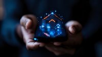 Glowing blue hologram house floating above cupped hands in dark background, smart home technology concept with digital icons and network connections.