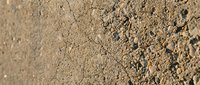 Dry cracked earth soil texture with natural fissures and rough surface for agriculture, drought, climate change and environmental backgrounds.