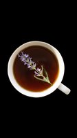 Top view of a white cup of herbal tea with a fresh lavender sprig, isolated on transparent background, ready for stickers, print on demand, and t-shirt design.