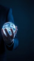 Businessman holding glowing energy sphere with electric lightning effects in dark blue atmosphere for technology and innovation concepts.