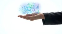 Business professional hand presenting holographic data analytics icons with charts, graphs and gears floating above palm on white background.