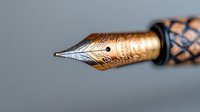 Elegant fountain pen nib with intricate golden engravings and decorative patterns on barrel, luxury writing instrument for professional correspondence and calligraphy.